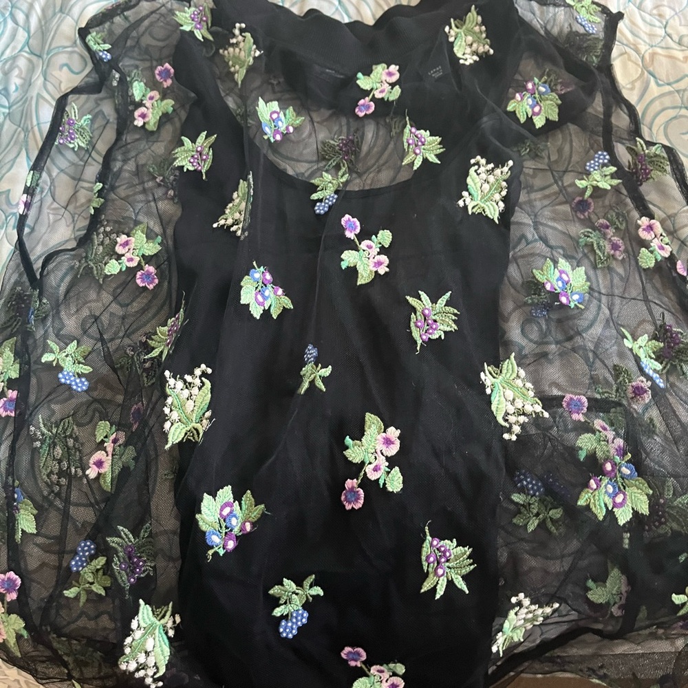 Sheer floral top with under black tank.